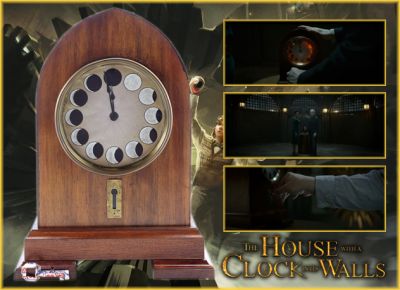 Isaac Izard's Clock and Playing Card Key
It was based on the 1973 novel of the same name by John Bellairs, which was the first in a series of 12 books. The film follows a young boy, Lewis Barnavelt (Owen Vaccaro), who is sent to live with his uncle, Jonathan, in a creaky old house. He soon learns it was previously inhabited by an evil Warlock. From the 2018 film The House with a Clock in its Walls, this is Isaac Izard's Clock and Playing Card Key the film is based around. Hidden inside Jonathanâ€™s house, Lewis uses a decoder to find the location of where it was hidden. They find the Bone key can unlock the clock turning back time and erasing all humanity. This particular clock is known as the breakaway clock and also includes the folded playing card key which was overlaid with CG to appear as if it was automatically folding into a key.


Keywords: Isaac Izard's Clock and Playing Card Key