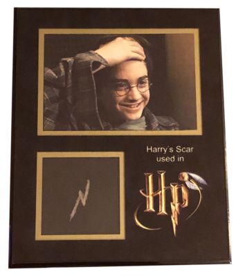 Harry Potterâ€™s (Daniel Radcliffe) Scar Prosthetic
Rescued from the outrageous neglect of his aunt and uncle, a young boy with a great destiny proves his worth while attending Hogwarts School of Witchcraft and Wizardry. From Harry Potter and the Sorcererâ€™s Stone this is Harry Potterâ€™s (Daniel Radcliffe) one and only original latex lightning bolt scar make up prosthetic. The scar on Harry's forehead in the shape of a lightning bolt is the result of a failed murder attempt by Lord Voldemort when he struck 15-month-old with the Killing Curse. Harry is the only known person to survive the curse because his mother's loving sacrifice protected him. Unbeknownst to Voldemort, the incident also inadvertently made Harry into a Horcrux, as a piece of the Dark Lord's soul embedded itself in Harry.
Keywords: Harry Potterâ€™s (Daniel Radcliffe) Scar Prosthetic