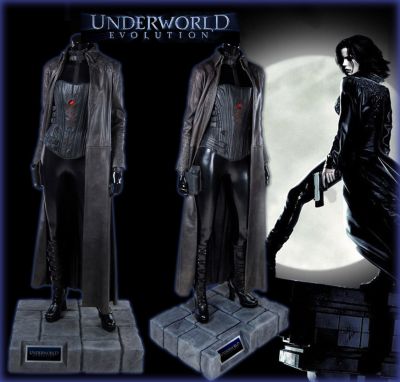 Selene's (Kate Beckinsale) Hero Costume
This is Seleneâ€™s (Kate Beckinsale) hero costume worn in the 2006 action film Underworld: Evolution. This style costume can be seen throughout the film as Selene and Michael (Scott Speedman) are searching for the truth behind their bloodlines.  The skintight black bodysuit is made of PVC and has a zipper closure from the neck to the lower torso with black leather zip-up arm gauntlets. The corset is leather and features a lace up back with black laces as well as two rear zippers running from top to bottom and eight leather straps that extend around the side and clip to the corsetâ€™s front. One black gun holster attached to the outside of the upper thighs using small, high powered magnets and mounted on a themed display of faux rocks from the buildings Selene visits throughout the film. This particular costume can easily be matched and seen on screen by the stab wound in the center of the corset when Marcus begins to go into combat with Selene and is enraged when a resurrected Michael fights and kills William. Marcus then drives a wing talon through Selene who survives due to her having previously drank of Alexander's blood. 
Keywords: Selene's (Kate Beckinsale) Hero Costume