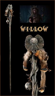 Franjean's (Rick Overton) Staff 
Franjean's (Rick Overton) staff from 1988 Ron Howard fantasy film Willow. Franjean carried his long staff when Willow was captured by the wood-dwelling brownies. The staff is made of wood and is decorated with trinkets, feathers, a rubber frilled lizard and a rubber snake. Tied to the staff with leather cords are a metal bell and numerous wooden bells. The snake and lizard are glued with their tails wrapped around the staff, with the lizard's frilled hood expanded to its 'open' position. 
Keywords: Franjean's (Rick Overton) Staff 