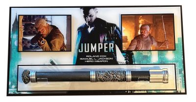 Roland Cox’s (Samuel L. Jackson) Hero  “Powerstick” Weapon
Individuals possess the ability to teleport themselves at will, and pursued by "Paladins," an extremist group hell-bent on searching out and destroying these "Jumpers". From the 2008 film Jumper, this is Roland’s (Samuel L. Jackson) hero working “Powerstick” weapon. Roland is a fanatical Paladin who uses this rod weapon to disable Jumpers long enough to kill them. This prop is made of resin and tooled aluminum components with leather wrap grip portion, lenticular paper section and central ornate sculptural griffon and lion battle with griffon head pommel. With a spring-loaded mid-section that depresses, allowing upper and lower sections to rotate and spring loaded to transform the style of the weapon into a baton.  This was the main one used and even has the net style weapon that shoots out of it seen during the film.
Keywords: Roland Cox’s (Samuel L. Jackson) Hero  “Powerstick” Weapon