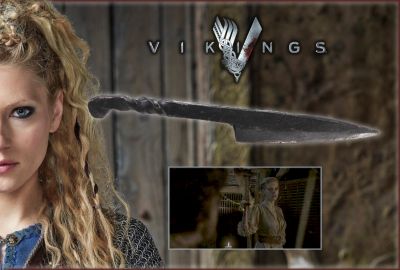 Lagertha's (Katheryn Winnick) Knife
Vikings transports us to the brutal and mysterious world of Ragnar Lothbrok (Travis Fimmel), a Viking warrior and farmer who yearns to explore - and raid - the distant shores across the ocean. From the Vikings 2014 season 2 episode 6 â€œUnforgivenâ€, this is the iconic knife made of hard plastic was used by Lagertha (Katheryn Winnick) when she stabs Sigvard in the eye. After accusing her of still being in love with Ragnar, he drunkenly claims that the bruised and battered Lagertha has the most beautiful breasts of any woman in the world and that they are like Freyja's breasts. To further demean and humiliate her, Sigvard rips her dress open to show his people Lagertha's breasts, but having had enough; she grabs a knife and stabs out one of his eyes. Screaming in pain, Sigvard falls to his knees. With the hall in shock and before anyone knows what to do, his nephew Einar draws his sword and approaches seemingly to kill Lagertha. He instead beheads Sigvard, sending the earl's head rolling on the rough wooden floor.
Keywords: Lagertha's (Katheryn Winnick) Knife