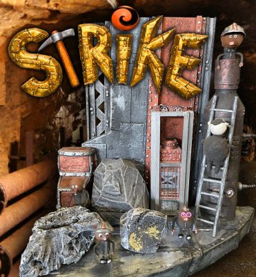 Miniature Mine Set and Puppets
A young mole must try to achieve his impossible dream of becoming a soccer player in order to save his hometown gold mine from a greedy supervillain known only as â€œThe Bossâ€. From the 2018 stop-motion film Strike, this is the miniature mine set along with the miniature puppets of Mungo, Ryan and other miner puppets. The elevator is a working elevator with a functional light, and other set pieces that have been displayed with the set.
Keywords: Miniature Mine Set and Puppets