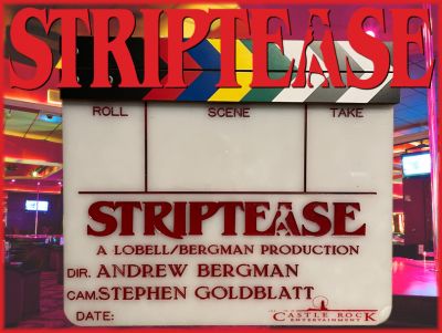 Striptease Clapper
This is a â€œclapperboardâ€ or slate from the 1996 comedy/crime film, Striptease. An exotic dancer (Demi Moore) was dragged into a conspiracy after she became the object of affection of a crooked politician. This white acrylic clapperboard with a multicolored striped wooden clapper is engraved in red "STRIPTEASE A LOBELL/BERGMAN PRODUCTION," "DIR. ANDREW BERGMAN," "CAM. STEPHEN GOLDBLATT" with the Castle Rock Entertainment logo on the bottom corner. Also obtained, a "B" camera acrylic clapperboard insert dated "11/08/95" with fastening strips on the back.
Keywords: Striptease Clapper